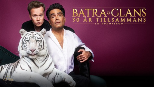 Två män poserar framför en mörkrosa bakgrund tillsammans med en vit tiger. Bildtext: Batra & Glans 30 år tillsammans. En humorshow.