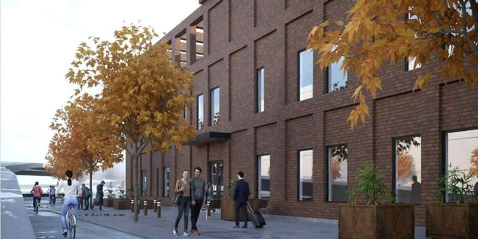 Skiss på ny brandstationens röda tegelfasad mot Barnhemsgatan. 